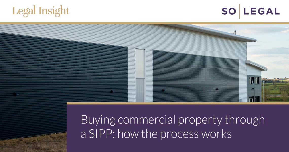 Modern industrial warehouse building with roller shutter doors, representing commercial property suitable for SIPP pension investment